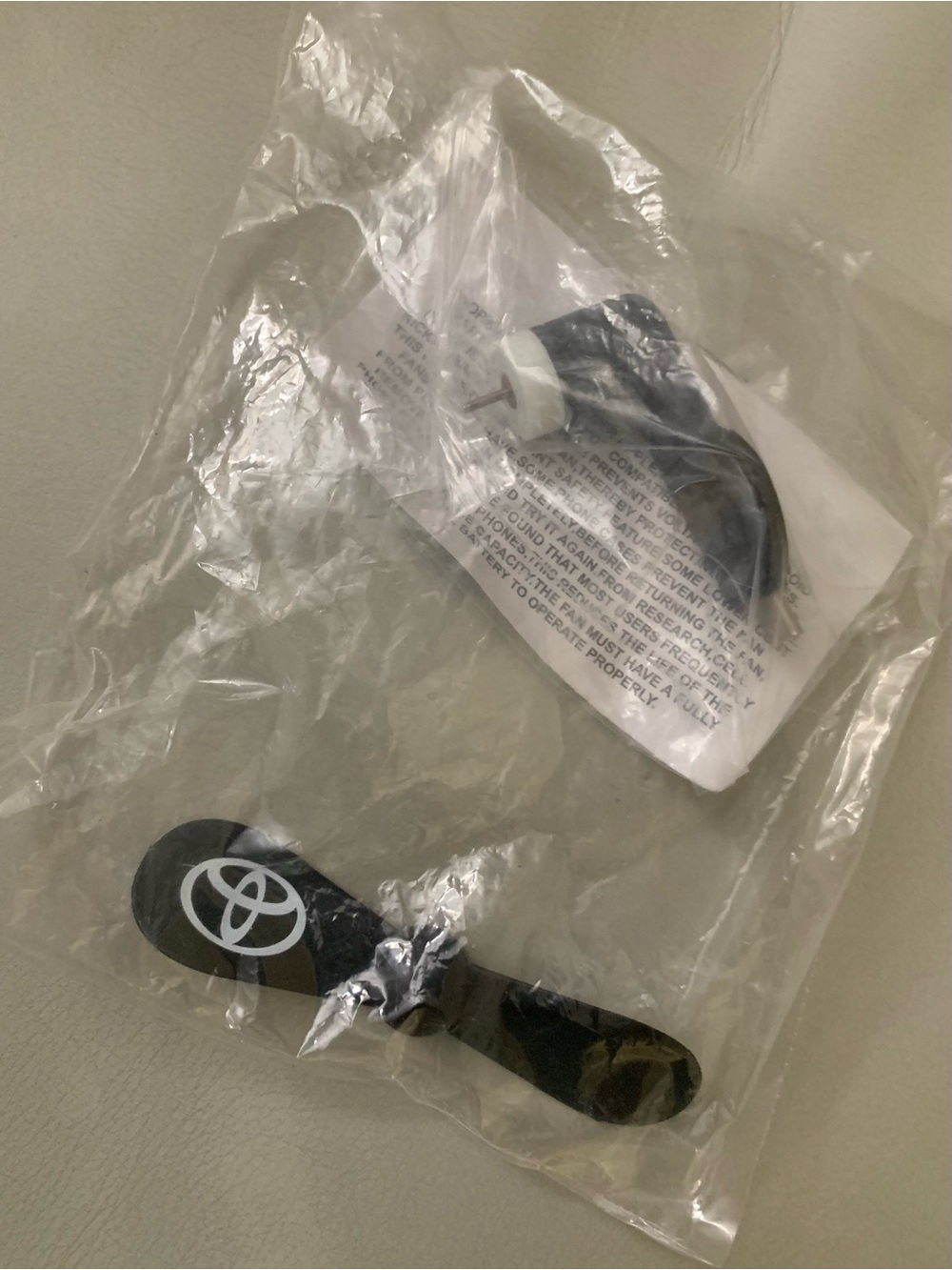 Mini  portable cell phone fan breeze to cool you off featuring the Toyota logo
